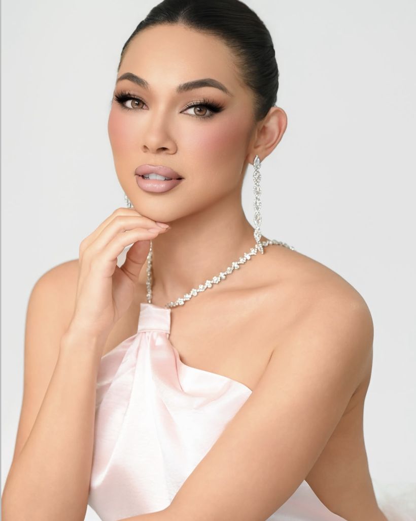 Client in a blush satin halter with crystal jewelry